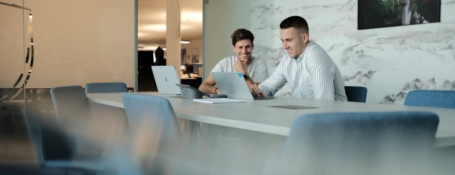 Two Tractive employees going over a project